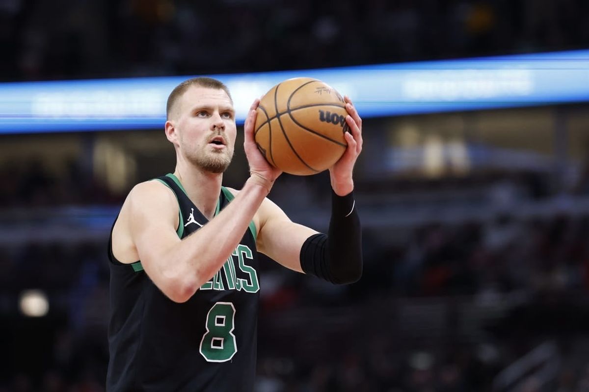 Feb 22, 2024; Chicago, Illinois, USA; Boston Celtics center Kristaps Porzingis (8) shoots a free throw against the Chicago Bulls during the second half at United Center.