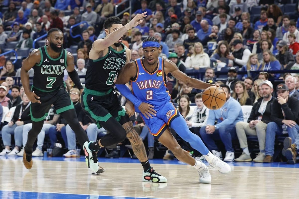 Jan 2, 2024; Oklahoma City, Oklahoma, USA; Oklahoma City Thunder guard Shai Gilgeous-Alexander (2) drives to the basket against Boston Celtics forward Jayson Tatum (0) during the second quarter at Paycom Center.