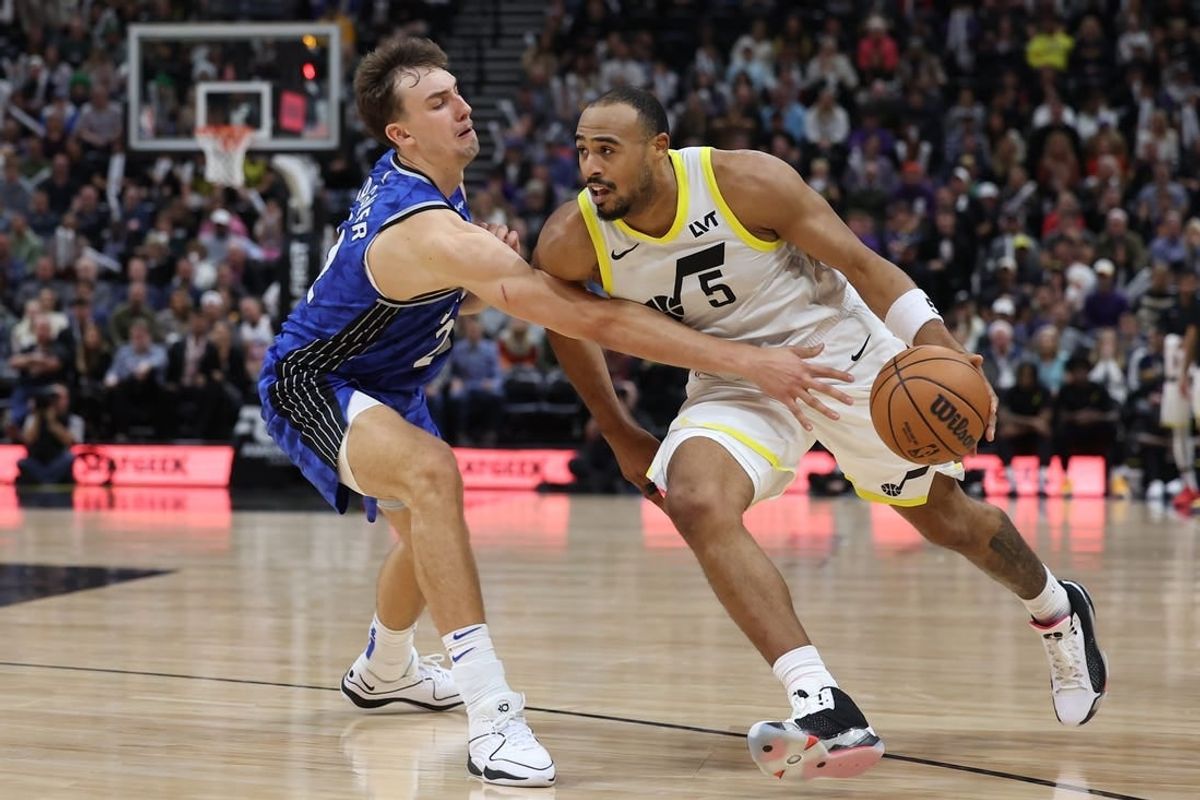 Nov 2, 2023; Salt Lake City, Utah, USA; Utah Jazz guard Talen Horton-Tucker (5) drives against Orlando Magic forward Franz Wagner (22) in the fourth quarter at the Delta Center.
