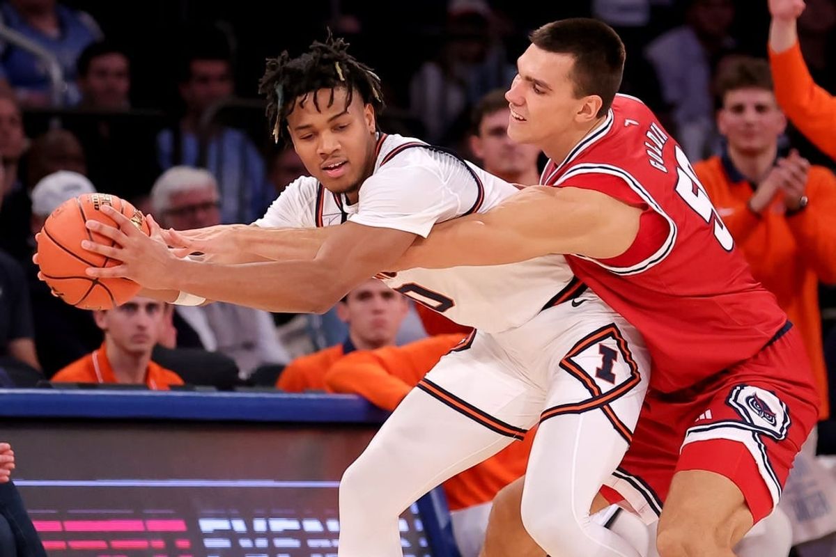Dec 5, 2023; New York, New York, USA; Illinois Fighting Illini guard Terrence Shannon Jr. (0) is fouled by Florida Atlantic Owls center Vladislav Goldin (50) during the second half at Madison Square Garden.