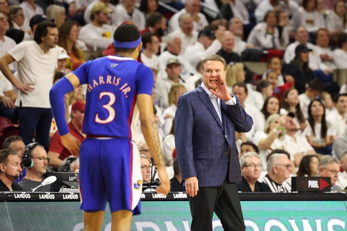 Feb 4, 2023; Ames, Iowa, USA;  Kansas Jayhawks head coach Bill Self talks with guard Dajuan Harris Jr. (3) during a game against the Iowa State Cyclones at James H. Hilton Coliseum.