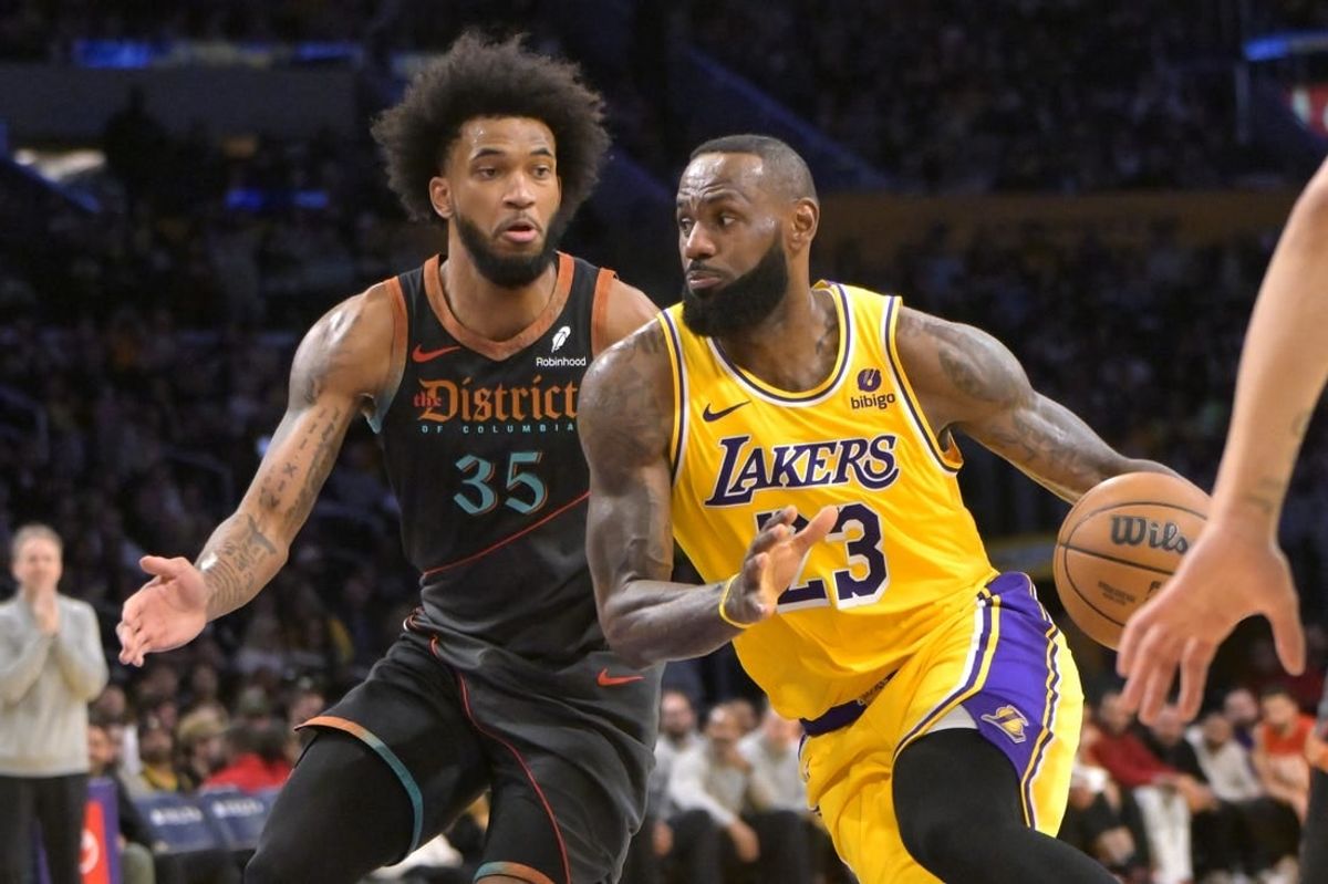 Feb 29, 2024; Los Angeles, California, USA;  Washington Wizards forward Marvin Bagley III (35) guards Los Angeles Lakers forward LeBron James (23) in the first half at Crypto.com Arena.
