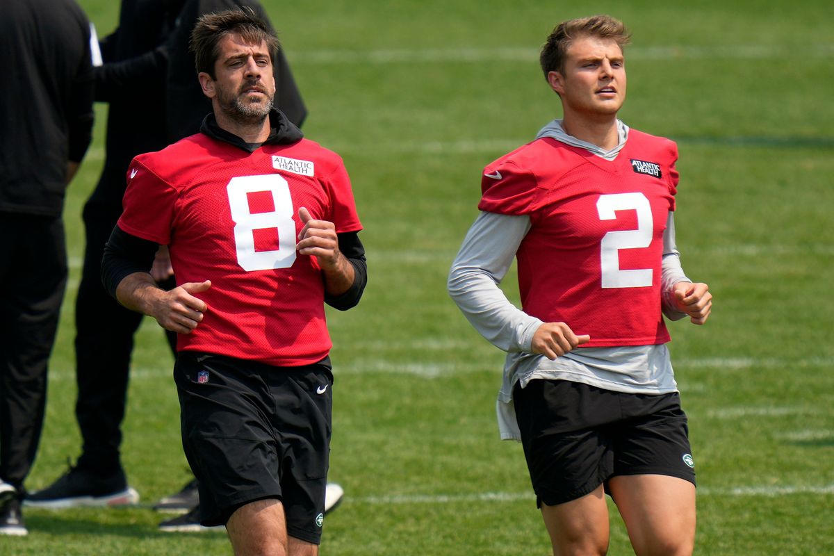 New York Jets quarterbacks Aaron Rodgers (left) and Zach Wilson