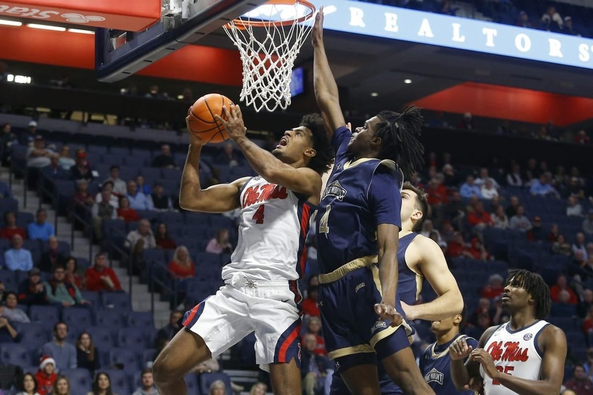 Dec 5, 2023; Oxford, Mississippi, USA; Mississippi Rebels forward Jaemyn Brakefield (4) drives to the basket as Mount St. Mary's Mountaineers forward Dola Adebayo (4) defends during the first half at The Sandy and John Black Pavilion at Ole Miss.