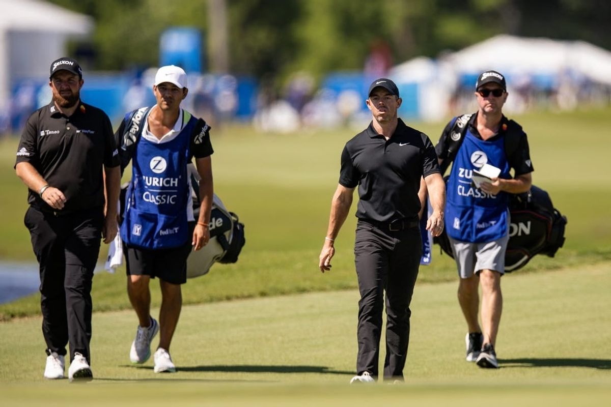 Apr 26, 2024; Avondale, Louisiana, USA; Rory McIlroy and Shane Lowry walks down the fairway to the 18th green during the second round of the Zurich Classic of New Orleans golf tournament.