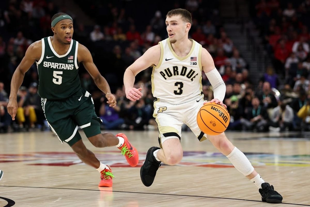 Mar 15, 2024; Minneapolis, MN, USA; Purdue Boilermakers guard Braden Smith (3) works around Michigan State Spartans guard Tre Holloman (5) during the first half at Target Center.