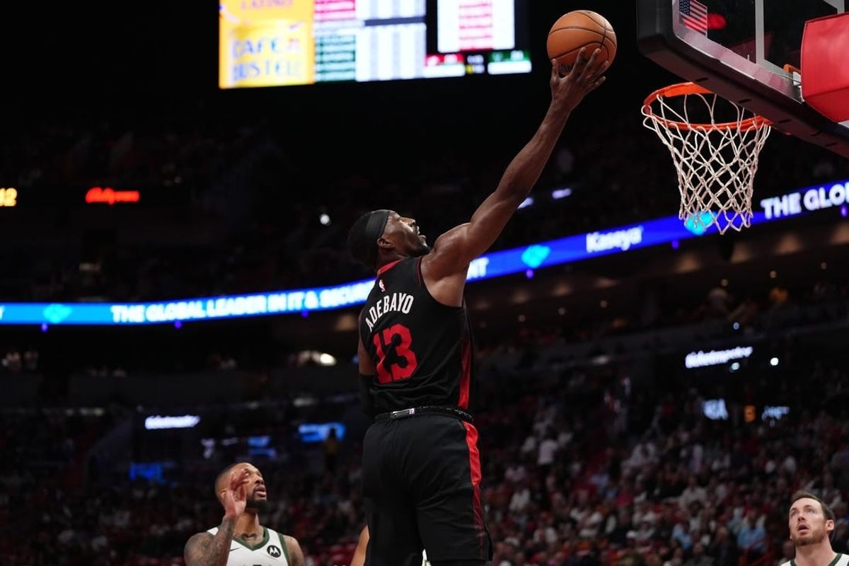 Nov 28, 2023; Miami, Florida, USA; Miami Heat center Bam Adebayo (13) puts up a shot against the Milwaukee Bucks during the first half at Kaseya Center.