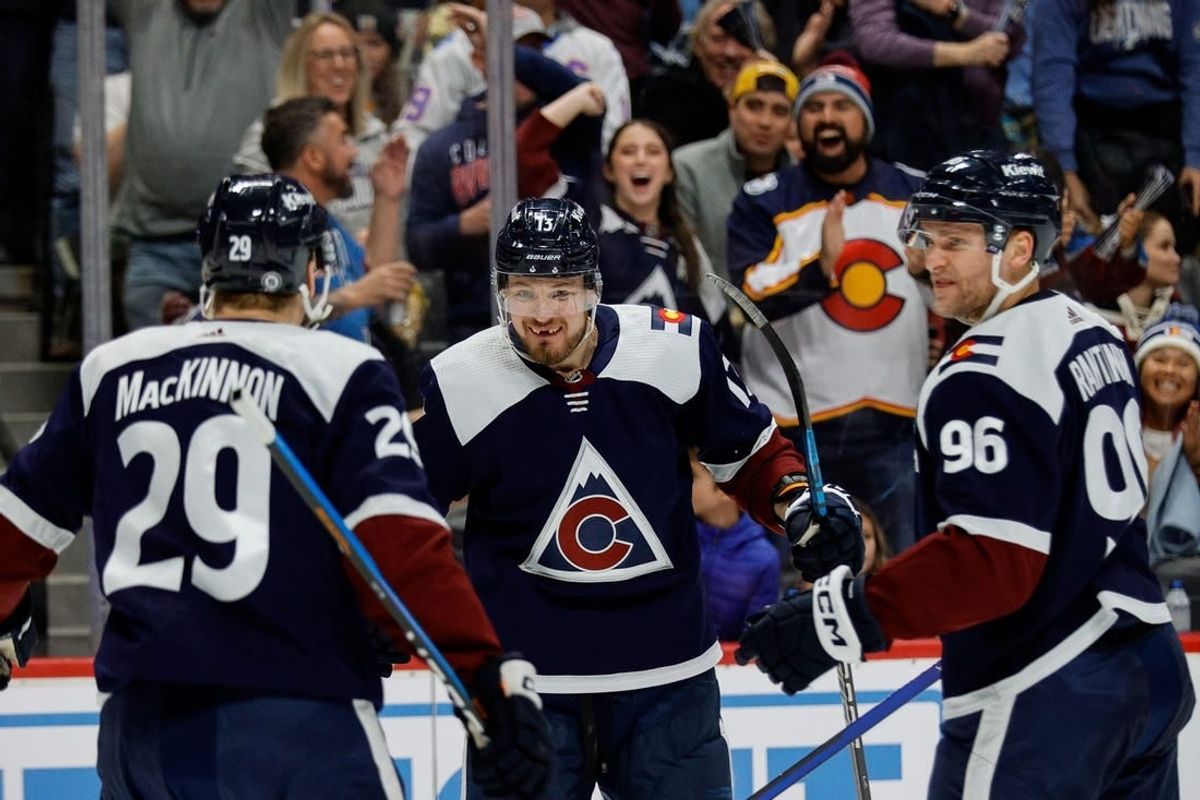 Dec 23, 2023; Denver, Colorado, USA; Colorado Avalanche right wing Valeri Nichushkin (13) celebrates his goal with center Nathan MacKinnon (29) and right wing Mikko Rantanen (96) in the second period against the Arizona Coyotes at Ball Arena.