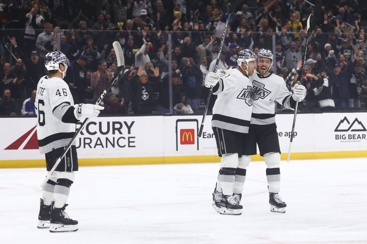 Dec 27, 2023; Los Angeles, California, USA; Los Angeles Kings center Trevor Lewis (61) celebrates with his teammates after scoring a goal during the second period of a game against the San Jose Sharks at Crypto.com Arena.
