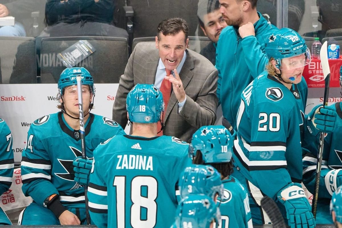 Oct 17, 2023; San Jose, California, USA; San Jose Sharks head coach David Quinn instructs San Jose Sharks right wing Filip Zadina (18) during a stoppage of play against the Carolina Hurricanes during the third period at SAP Center at San Jose.