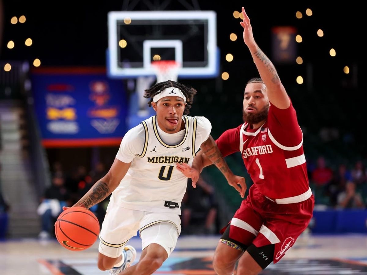 Nov 23, 2023; Paradise Island, BAHAMAS;  Michigan Wolverines guard Dug McDaniel (0) drives to the basket as Stanford Cardinal guard Jared Bynum (1) defends during the first half at Imperial Arena.
