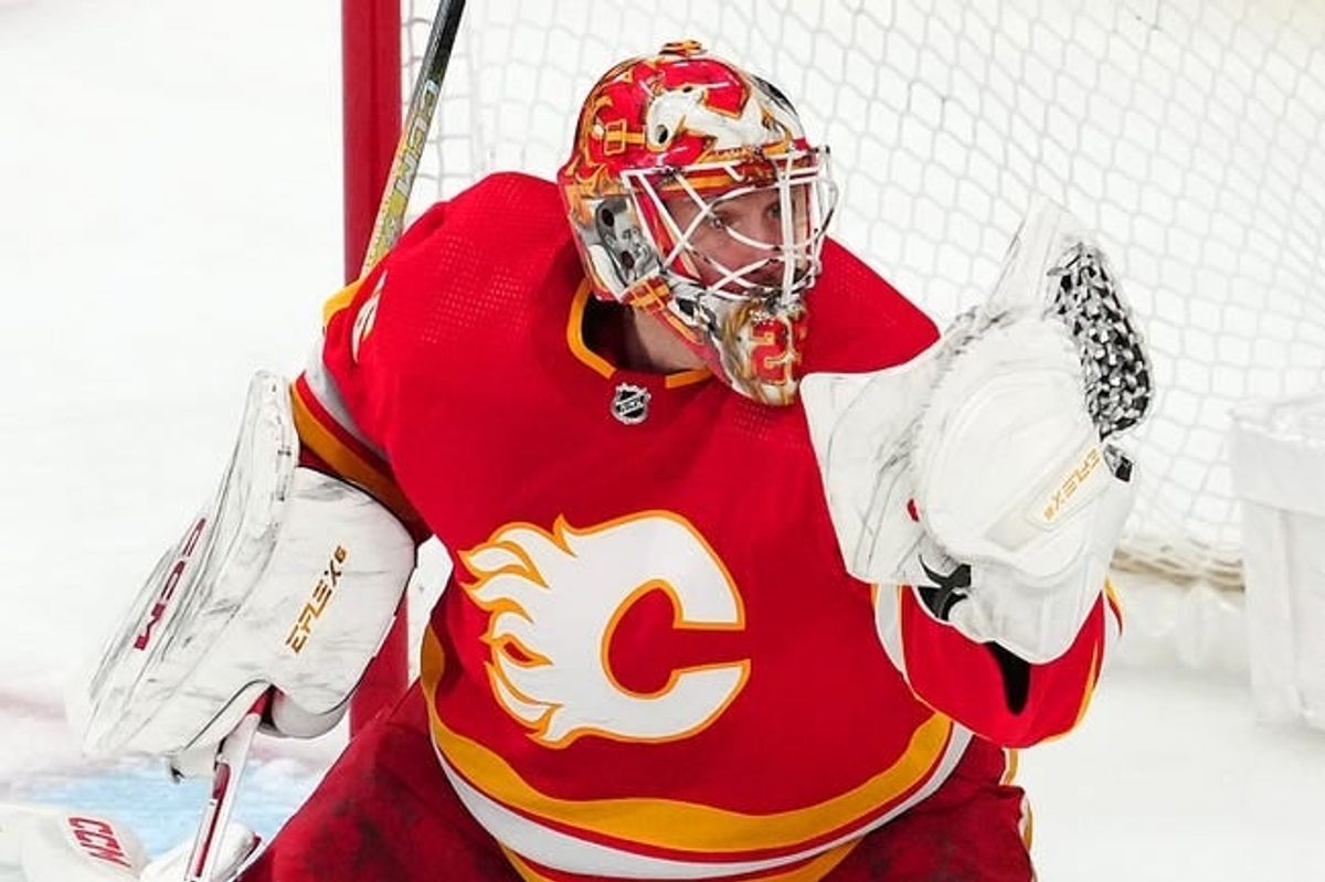 Jan 13, 2024; Las Vegas, Nevada, USA; Calgary Flames goaltender Jacob Markstrom (25) makes a glove save against the Vegas Golden Knights during the third period at T-Mobile Arena.