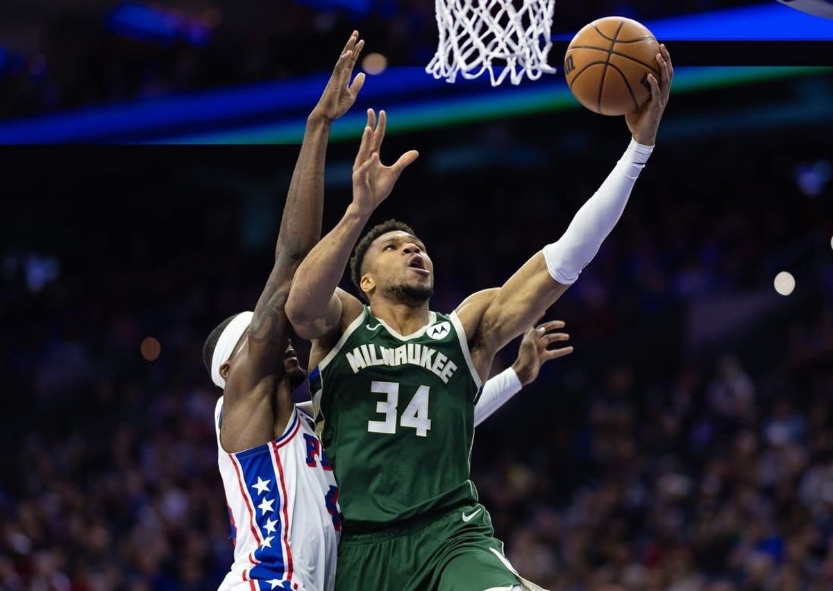 Feb 25, 2024; Philadelphia, Pennsylvania, USA; Milwaukee Bucks forward Giannis Antetokounmpo (34) drives for a score past Philadelphia 76ers forward Paul Reed (44) during the second quarter at Wells Fargo Center.