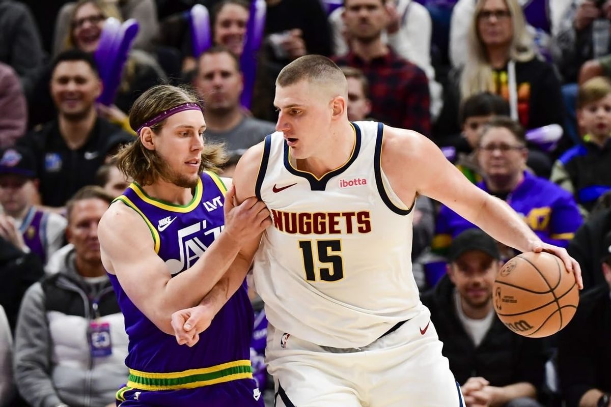 Jan 10, 2024; Salt Lake City, Utah, USA; Utah Jazz forward/center Kelly Olynyk (41) defends Denver Nuggets center Nikola Jokic (15) during the second half at the Delta Center.