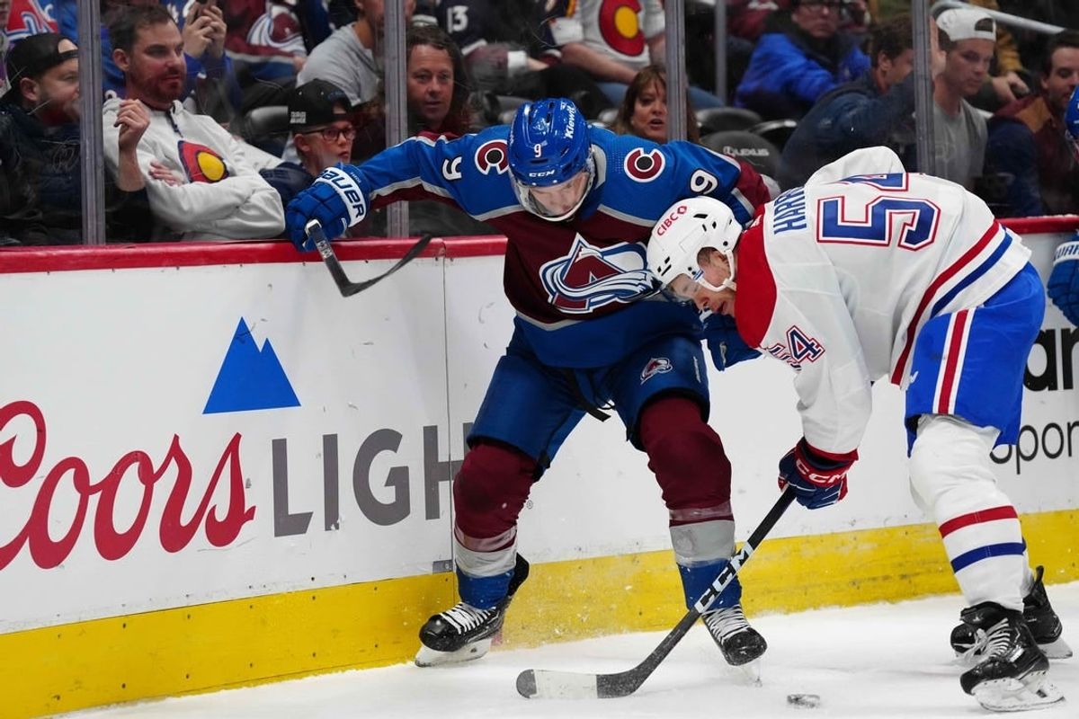 Mar 26, 2024; Denver, Colorado, USA; Montreal Canadiens defenseman Jordan Harris (54) and Colorado Avalanche left wing Zach Parise (9) battle for the puck in the first period at Ball Arena.