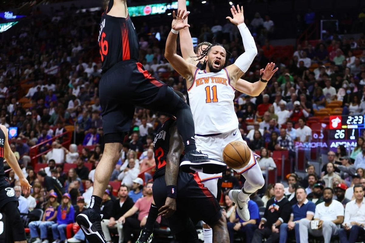 Apr 2, 2024; Miami, Florida, USA; New York Knicks guard Jalen Brunson (11) reacts after driving to the basket against Miami Heat forward Caleb Martin (16) during the first quarter at Kaseya Center.