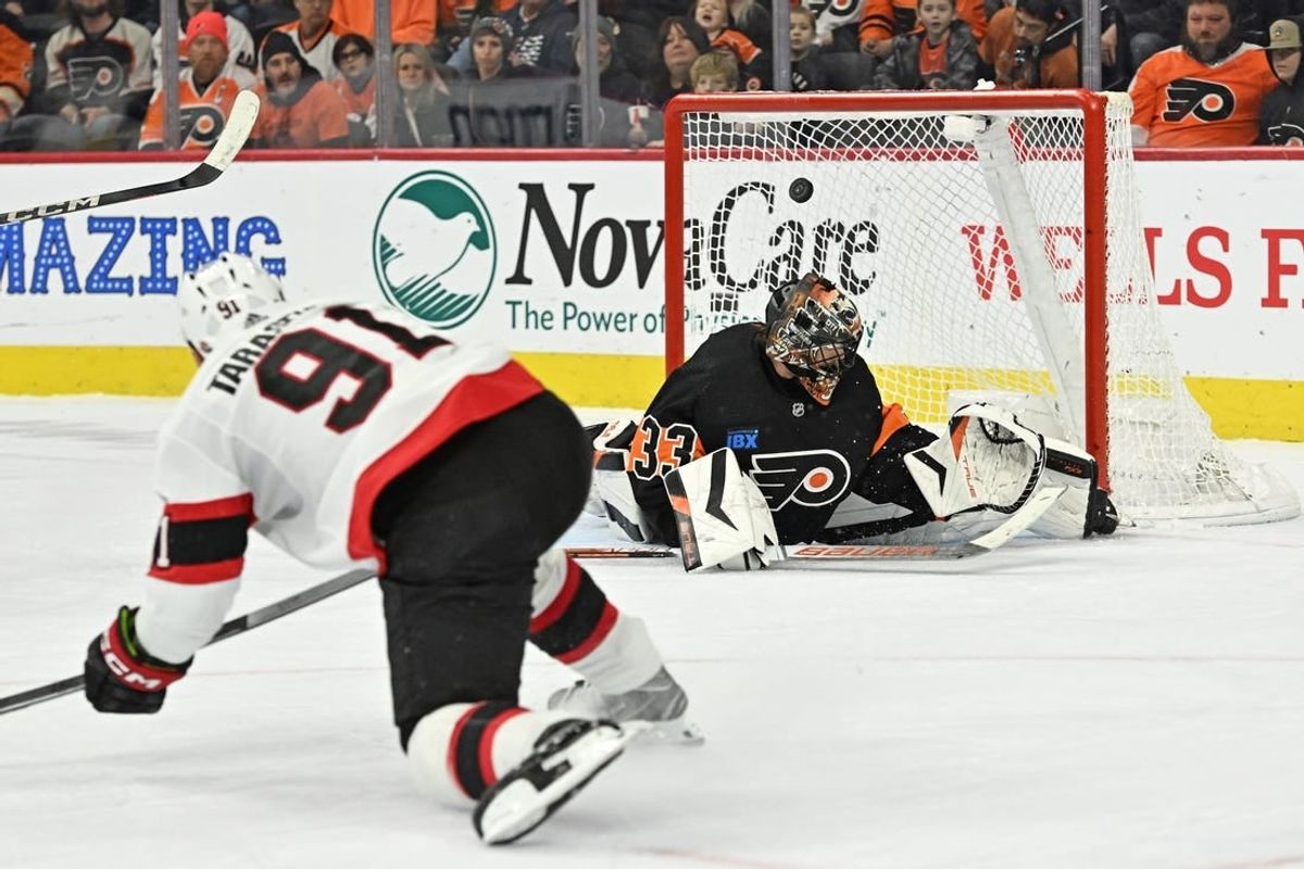 Jan 21, 2024; Philadelphia, Pennsylvania, USA; Ottawa Senators right wing Vladimir Tarasenko (91) scores a goal against Philadelphia Flyers goaltender Samuel Ersson (33) during the third period at Wells Fargo Center.
