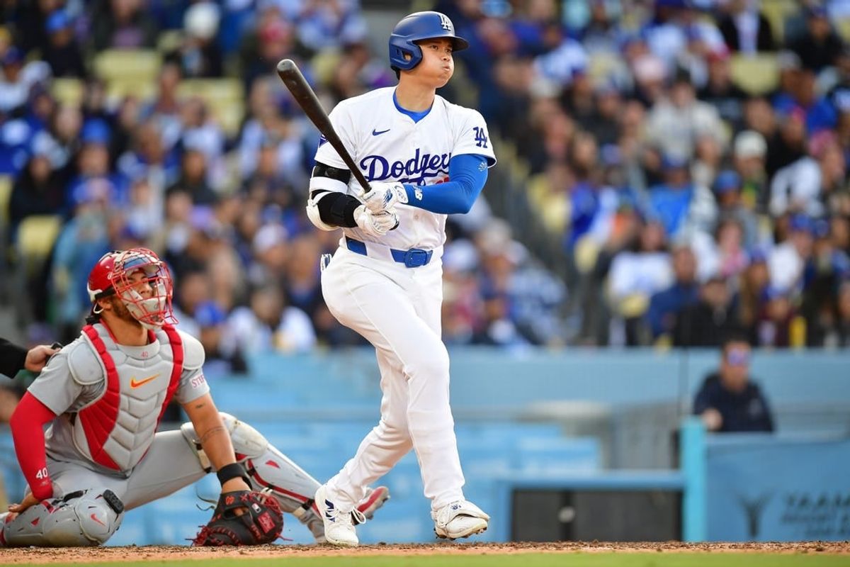 Mar 31, 2024; Los Angeles, California, USA; Los Angeles Dodgers designated hitter Shohei Ohtani (17) hits a double against the St. Louis Cardinals during the sixth inning at Dodger Stadium.