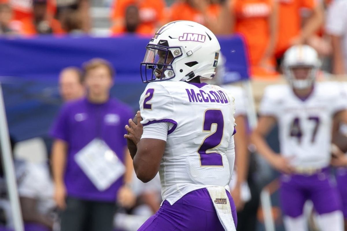 Sept 9, 2023; Charlottesville, Virginia, USA; James Madison Dukes quarterback Jordan McCloud (2) looks for a pass to an open player during the second half of the game against the Virginia Cavaliers at Scott Stadium.