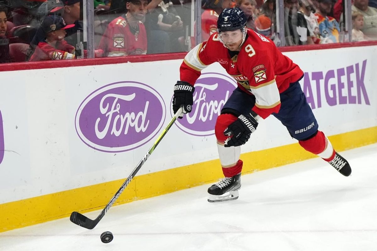 Nov 20, 2023; Sunrise, Florida, USA; Florida Panthers center Sam Bennett (9) chases a loose puck during the first period against the Edmonton Oilers at Amerant Bank Arena.