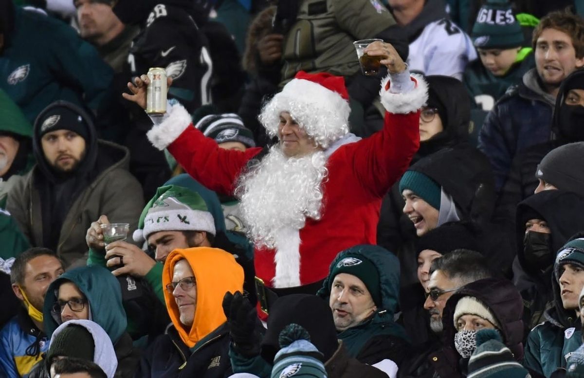Dec 21, 2021; Philadelphia, Pennsylvania, USA; A Philadelphia Eagles fan dressed as Santa cheers during the fourth quarter against the Washington Football Team at Lincoln Financial Field.