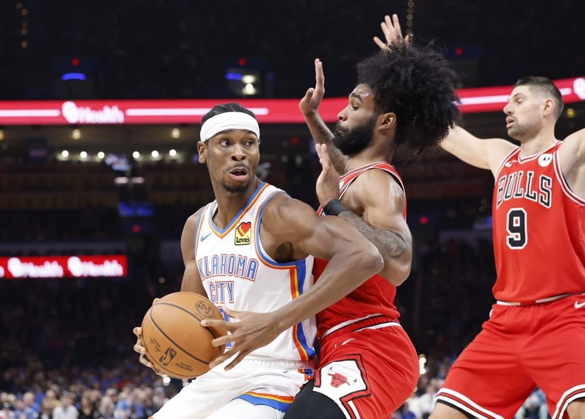 Nov 22, 2023; Oklahoma City, Oklahoma, USA; Oklahoma City Thunder guard Shai Gilgeous-Alexander (2) is defended by Chicago Bulls guard Coby White (0) on a drive to the basket during the second quarter at Paycom Center.