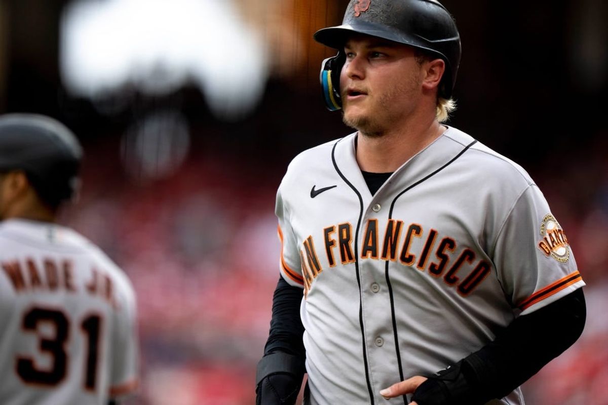 San Francisco Giants designated hitter Joc Pederson (23) smiles after scoring a run in the tenth inning of the MLB baseball game between the Cincinnati Reds and San Francisco Giants at Great American Ball Park in Cincinnati on Tuesday, July 18, 2023. This was during a continuation of yesterdays game which was suspended after a long rain delay.