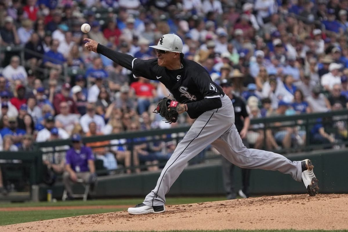 Feb 23, 2024; Mesa, Arizona, USA; Chicago White Sox pitcher Jesse Chavez (60) throws against the Chicago Cubs in the first inning at Sloan Park.