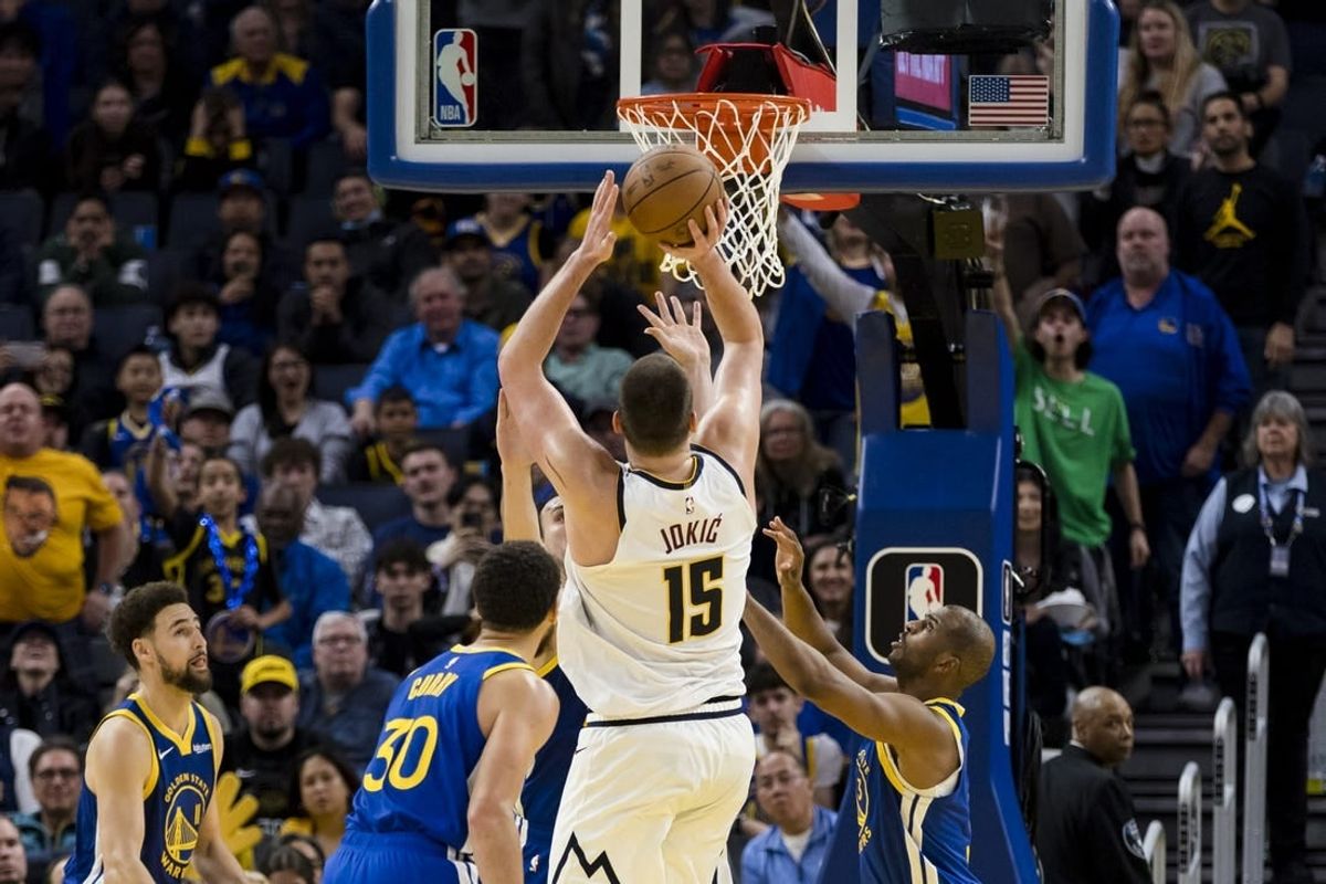 Jan 4, 2024; San Francisco, California, USA; Denver Nuggets center Nikola Jokic (15) hits a shot against the Golden State Warriors late in the second half at Chase Center.