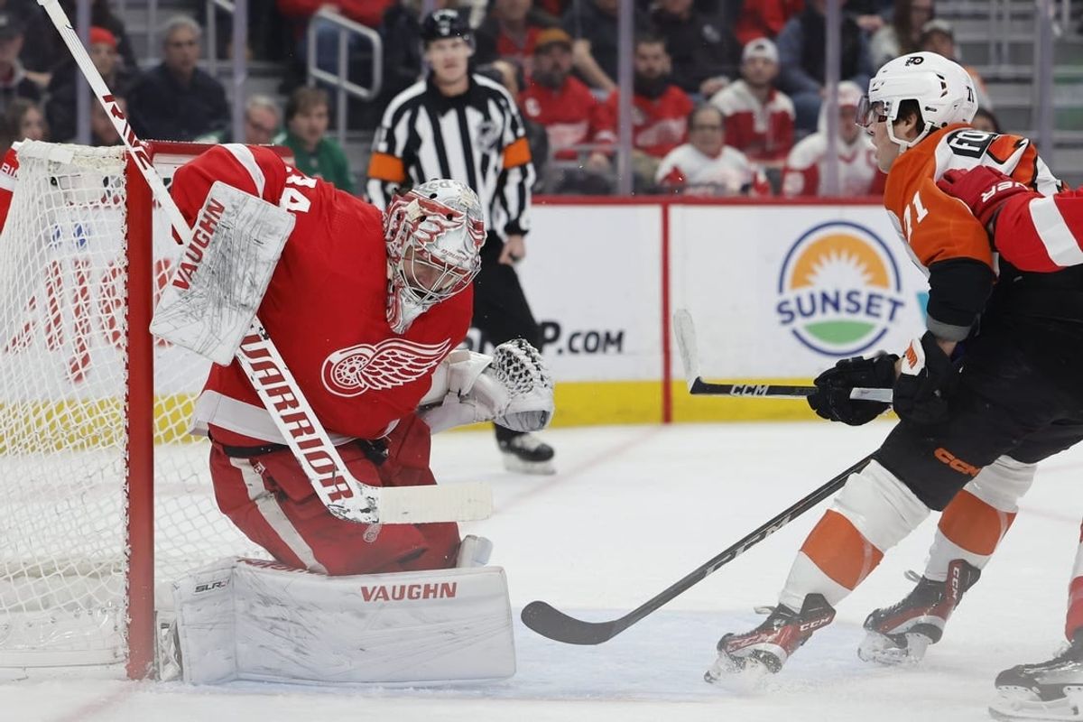 Jan 25, 2024; Detroit, Michigan, USA;  Detroit Red Wings goaltender Alex Lyon (34) makes a save on Philadelphia Flyers right wing Tyson Foerster (71) in the first period at Little Caesars Arena.