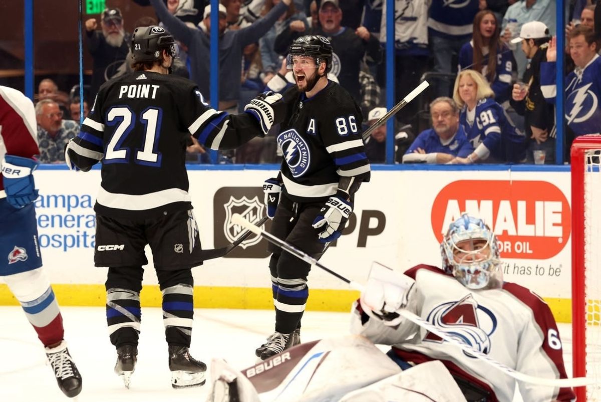 Feb 15, 2024; Tampa, Florida, USA; Tampa Bay Lightning right wing Nikita Kucherov (86) celebrates with Tampa Bay Lightning center Brayden Point (21) after he scored a goal on Colorado Avalanche goaltender Justus Annunen (60) during the third period at Amalie Arena.