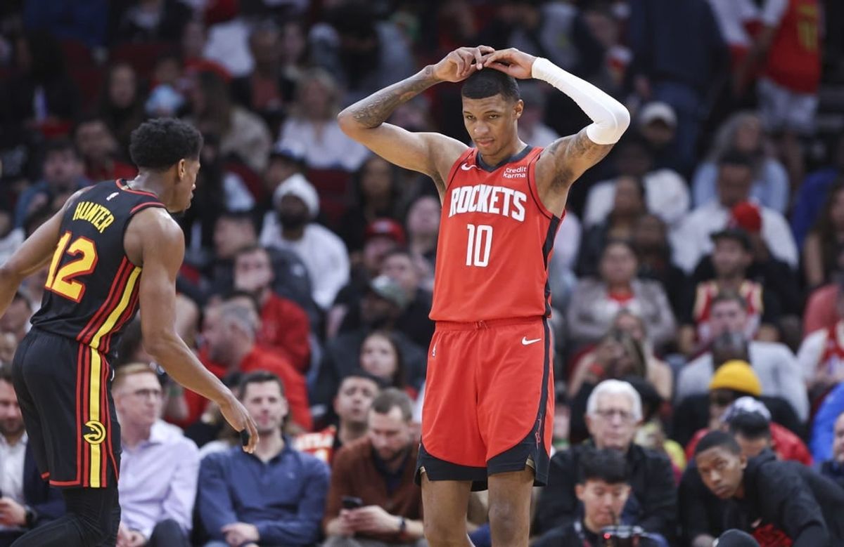 Dec 20, 2023; Houston, Texas, USA; Houston Rockets forward Jabari Smith Jr. (10) reacts after a play during the second quarter against the Atlanta Hawks at Toyota Center.