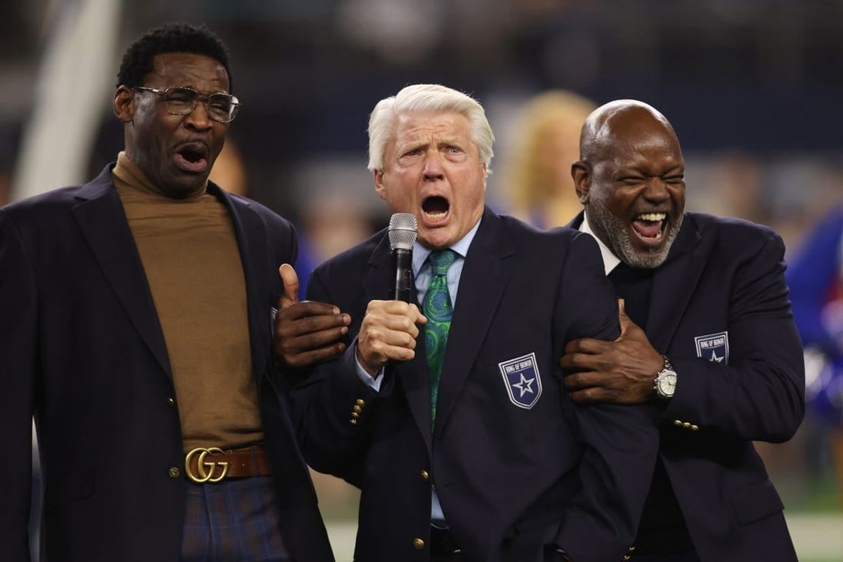 Dec 30, 2023; Arlington, Texas, USA; (L to R) Former Dallas Cowboys Michael Irvin, Jimmy Johnson and Emmitt Smith react during the Ring of Honor ceremony at the half time of the game against the Detroit Lions at AT&T Stadium.