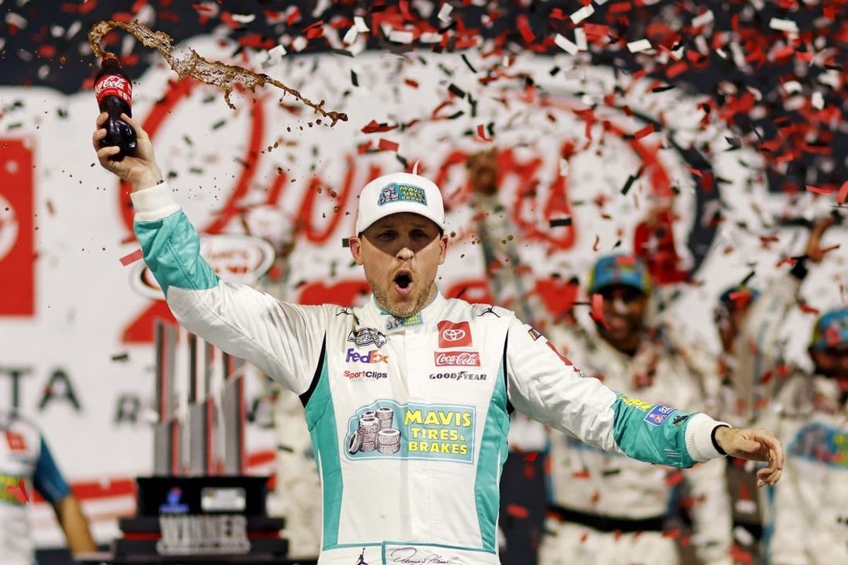 Mar 31, 2024; Richmond, Virginia, USA; NASCAR Cup Series driver Denny Hamlin (11) celebrates winning the Toyota Owners 400 at Richmond Raceway.