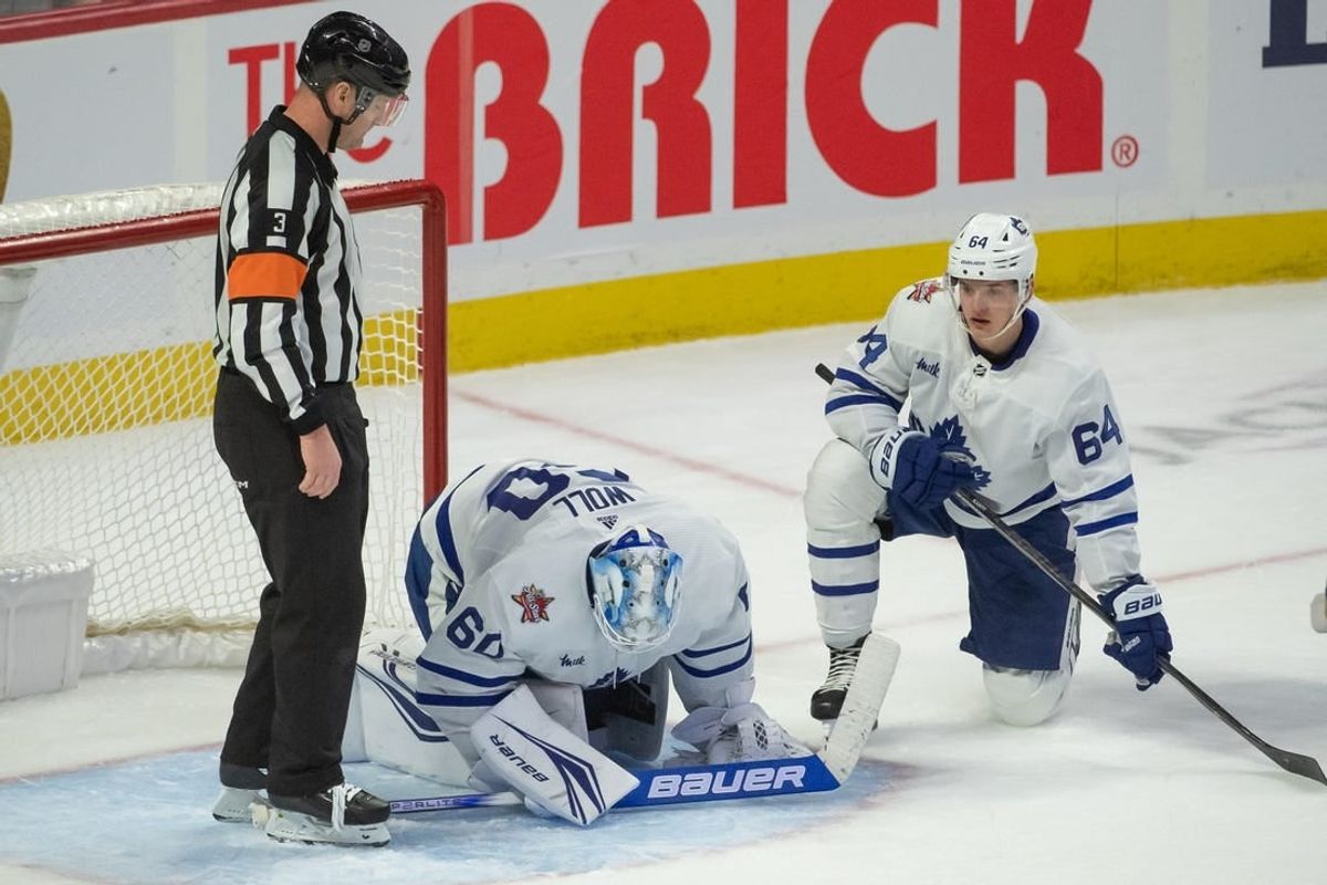 Dec 7, 2023; Ottawa, Ontario, CAN; Toronto Maple Leafs goalie Joseph Woll (60) is injured on a play in the third period against the  Ottawa Senators at the Canadian Tire Centre.