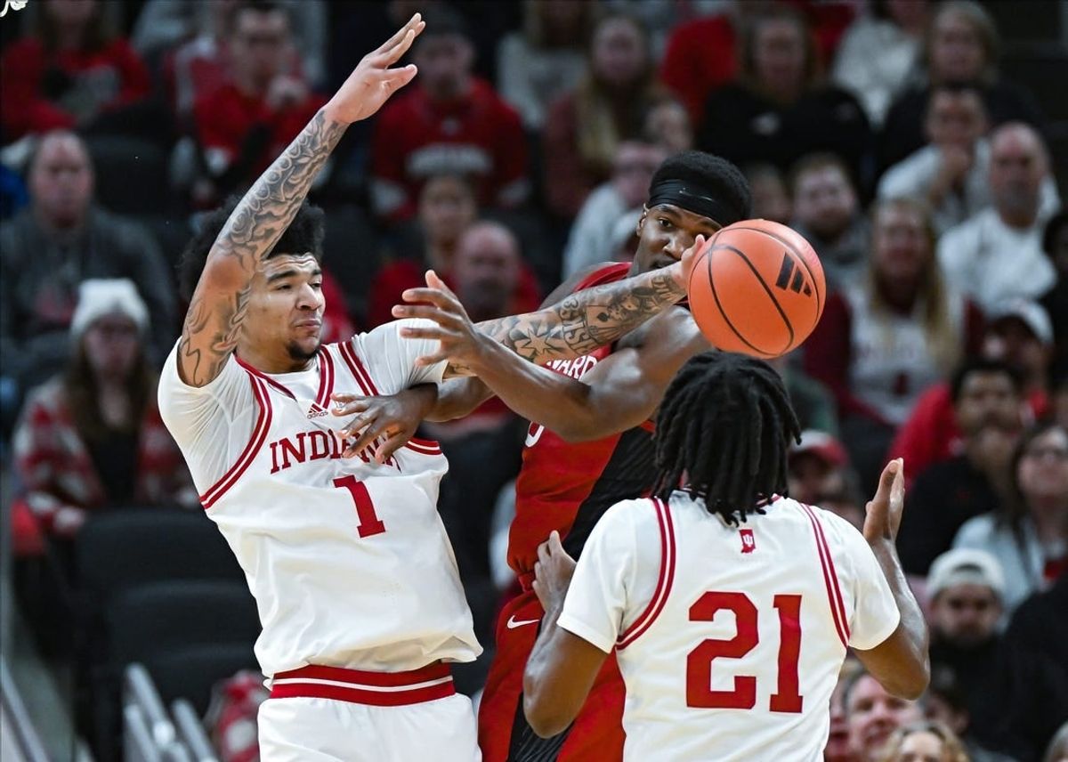 Indiana Hoosiers center Kel'el Ware (1) knocks the ball away from Harvard Crimson guard Chandler Pigge (13) during the game against Harvard in Gainbridge Fieldhouse in Indianapolis, Ind. on Sunday, Nob. 26, 2023.