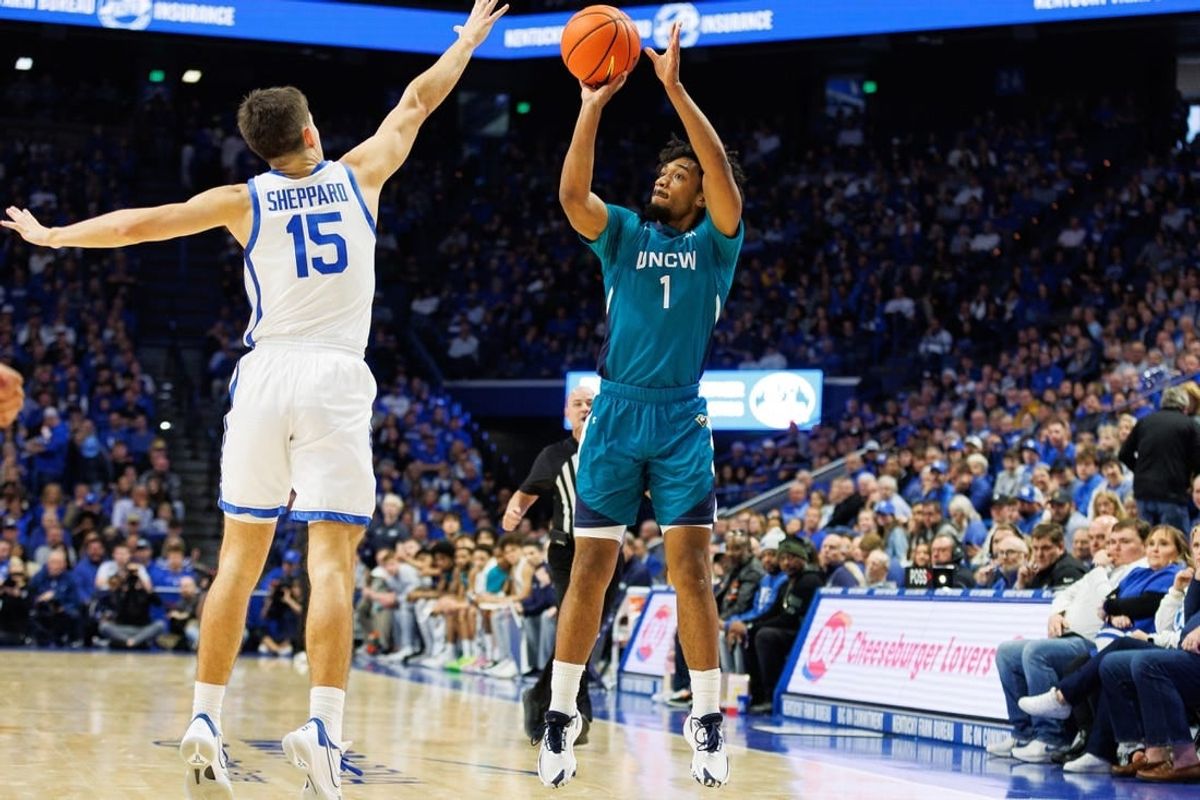 Dec 2, 2023; Lexington, Kentucky, USA; North Carolina-Wilmington Seahawks guard Donovan Newby (1) shoots the ball against Kentucky Wildcats guard Reed Sheppard (15) during the first half at Rupp Arena at Central Bank Center.