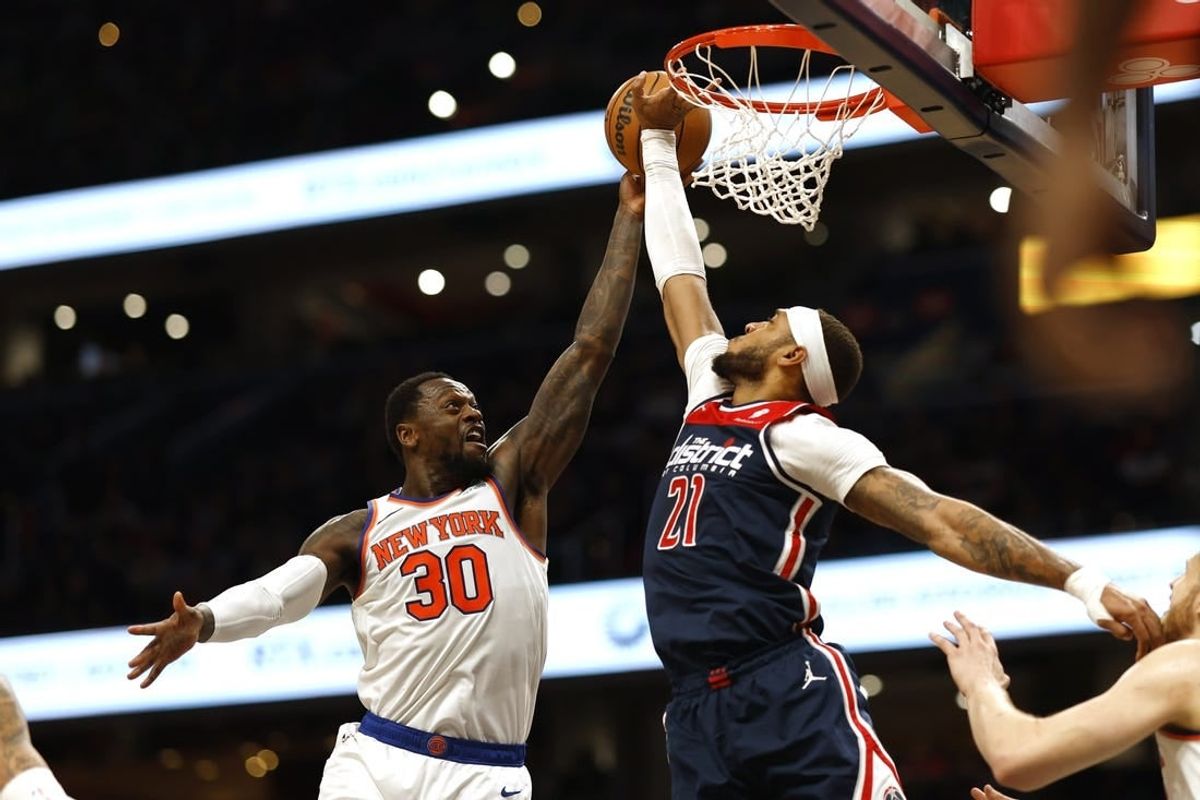 Jan 6, 2024; Washington, District of Columbia, USA; Washington Wizards center Daniel Gafford (21) blocks the shot of New York Knicks forward Julius Randle (30) in the second quarter at Capital One Arena.