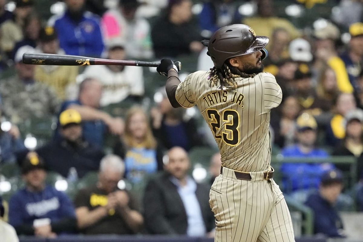 Apr 16, 2024; Milwaukee, Wisconsin, USA;  San Diego Padres right fielder Fernando Tatis Jr. (23) singles during the fifth inning against the Milwaukee Brewers at American Family Field.