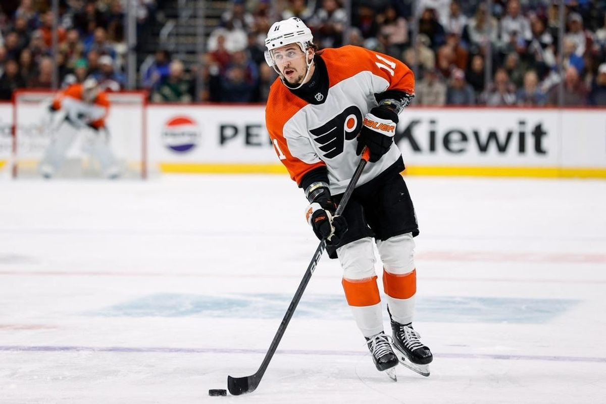 Dec 9, 2023; Denver, Colorado, USA; Philadelphia Flyers right wing Travis Konecny (11) controls the puck on a penalty shot in the third period against the Colorado Avalanche at Ball Arena.