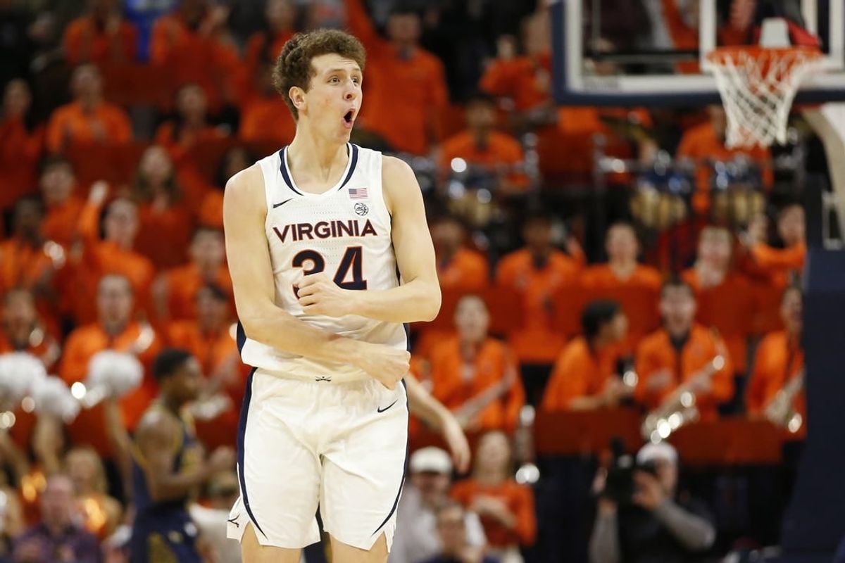 Jan 31, 2024; Charlottesville, Virginia, USA; Virginia Cavaliers forward Jacob Groves (34) celebrates after scoring against the Notre Dame Fighting Irish during the first half at John Paul Jones Arena.