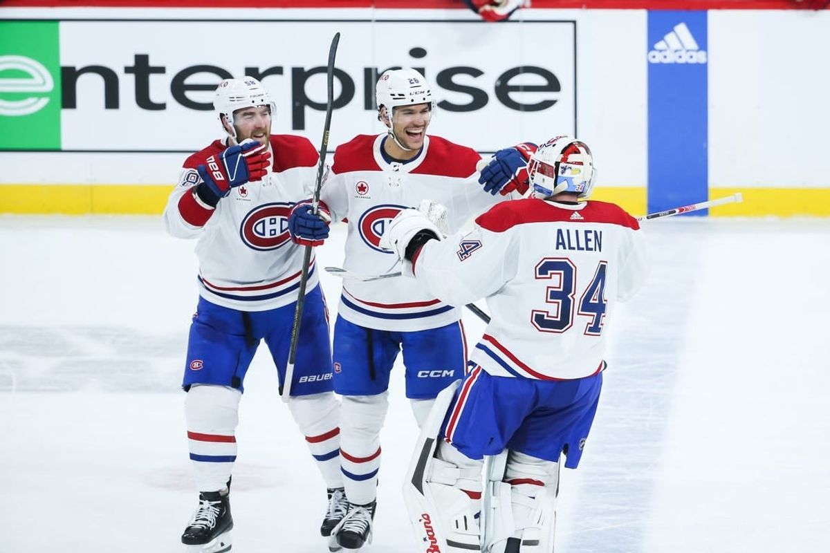 Dec 18, 2023; Winnipeg, Manitoba, CAN;  Montreal Canadiens goalie Jake Allen (34) is congratulated by his team mates on his win against the Winnipeg Jets at the end of the overtime period at Canada Life Centre.