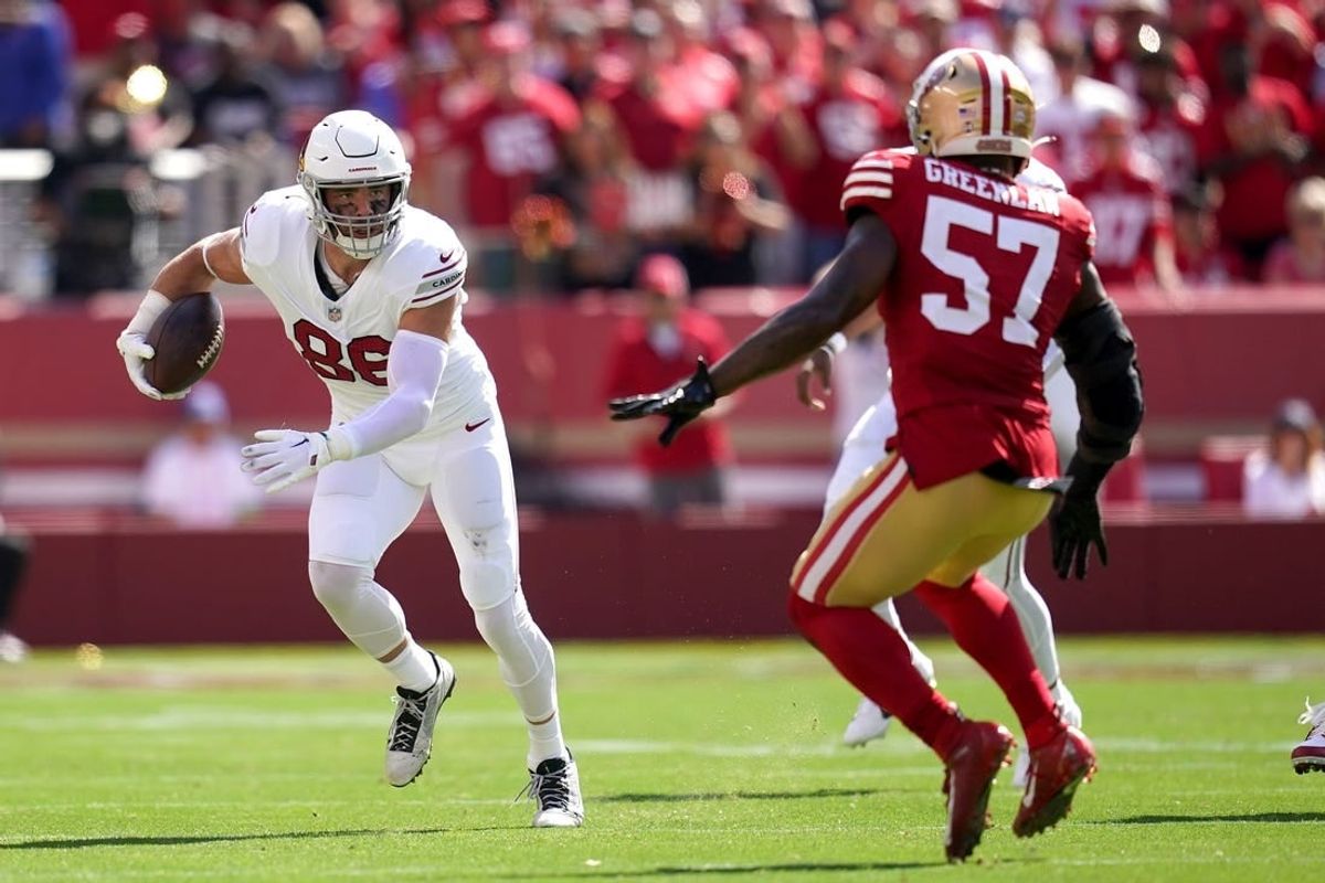 Tight end Zach Ertz (86) runs with the ball after making a catch next to San Francisco 49ers linebacker Dre Greenlaw (57) in the second quarter at Levi's Stadium.