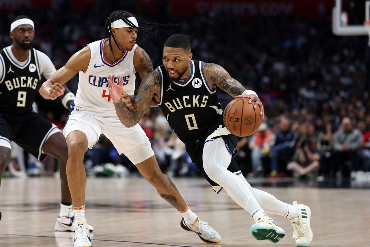 Mar 10, 2024; Los Angeles, California, USA;  Milwaukee Bucks guard Damian Lillard (0) drives to the basket against Los Angeles Clippers guard Brandon Boston Jr. (4) during the third quarter at Crypto.com Arena.