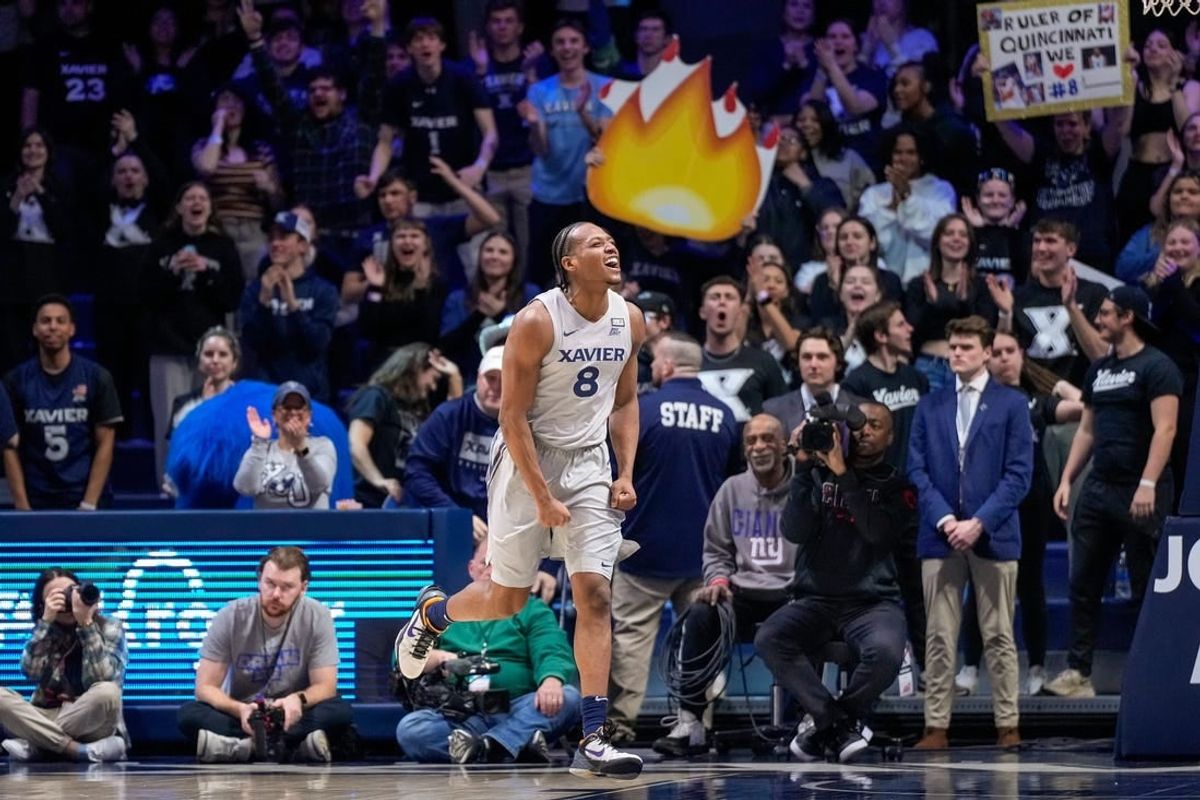 Xavier Musketeers guard Quincy Olivari (8) celebrates in the second half of the NCAA Big East conference basketball game between the Xavier Musketeers and the DePaul Blue Demons at the Cintas Center in Cincinnati on Wednesday, Feb. 28, 2024.