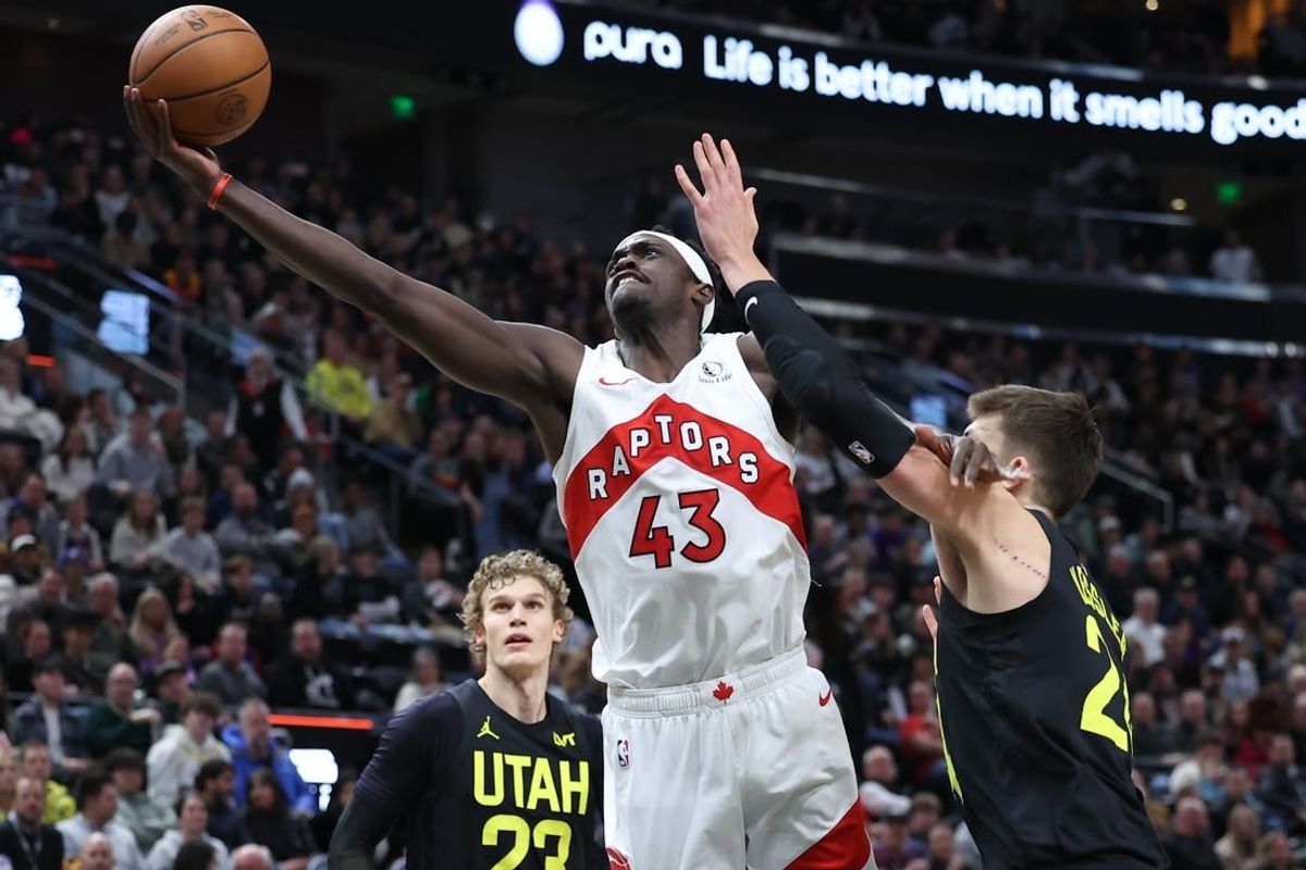 Jan 12, 2024; Salt Lake City, Utah, USA; Toronto Raptors forward Pascal Siakam (43) lays the ball up past Utah Jazz center Walker Kessler (24) during the third quarter at Delta Center.