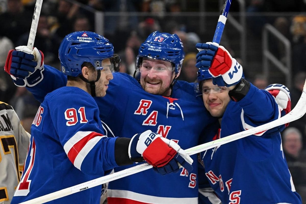 Mar 21, 2024; Boston, Massachusetts, USA; New York Rangers left wing Artemi Panarin (10) celebrates with left wing Alexis Lafreniere (13) and center Alex Wennberg (91) after scoring a goal against the Boston Bruins during the second period at the TD Garden.
