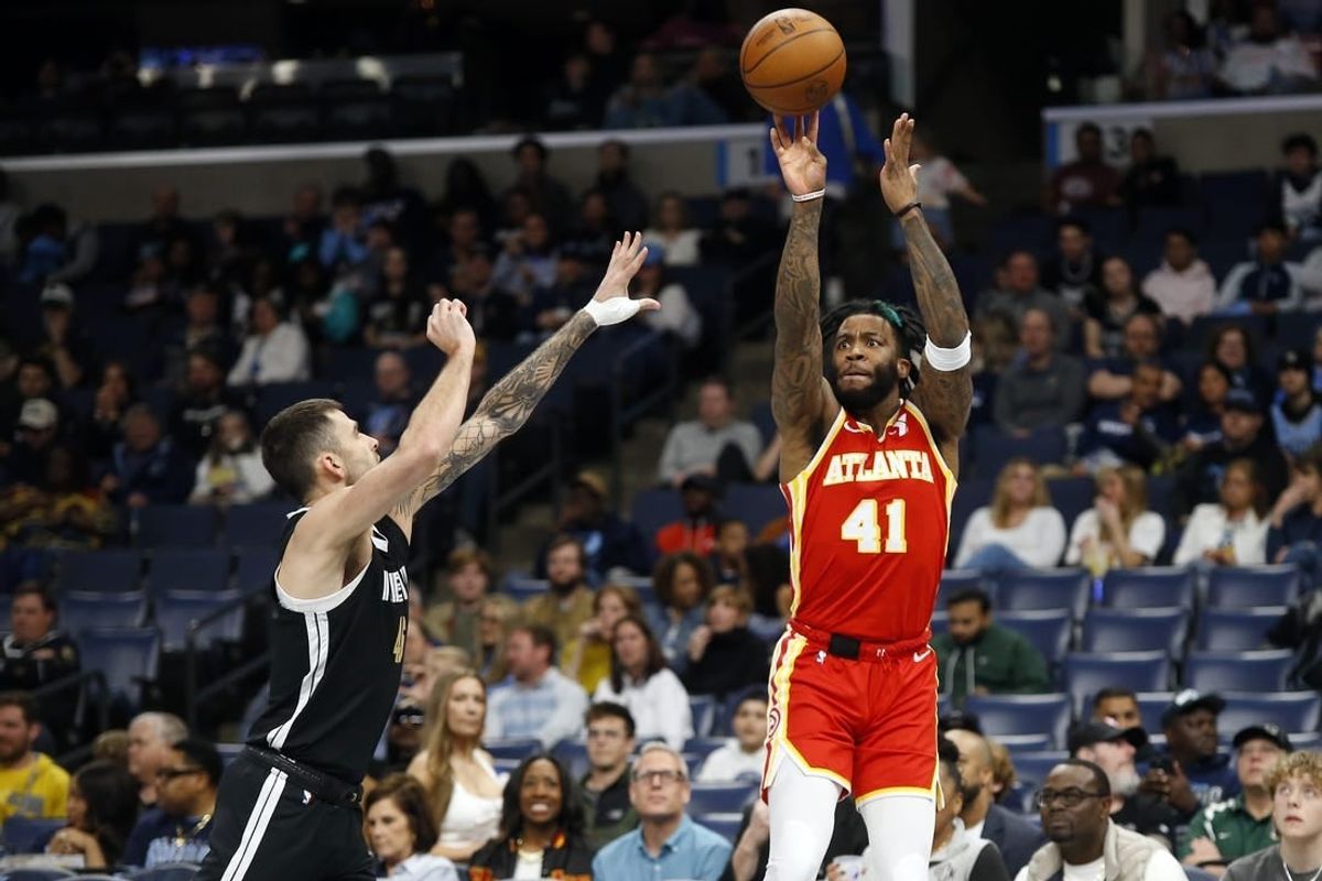 Mar 8, 2024; Memphis, Tennessee, USA; Atlanta Hawks forward Saddiq Bey (41) shoots for three as Memphis Grizzlies guard John Konchar (46) defends during the first half at FedExForum.