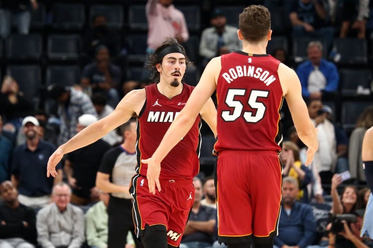 Nov 8, 2023; Memphis, Tennessee, USA; Miami Heat guard Jaime Jaquez Jr. (11) reacts with forward Duncan Robinson (55) after a three point basket during the second half against the Memphis Grizzlies at FedExForum.