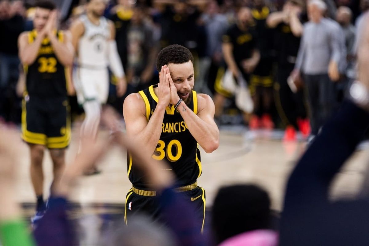 Dec 19, 2023; San Francisco, California, USA; Golden State Warriors guard Stephen Curry (30) reacts after scoring against the Boston Celtics during the overtime period at Chase Center.